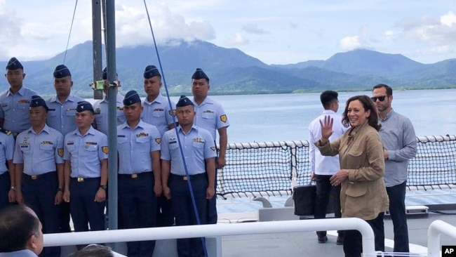 In this photo provided by the Philippine Coast Guard, U.S. Vice President Kamala Harris waves on board the Philippine Coast Guard BRP Teresa Magbanua (MRRV-9701) during her visit to Puerto Princesa, Palawan province, western Philippines, Nov. 22, 2022.