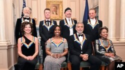 2022 Kennedy Center Honorees, front row from left, Amy Grant, Gladys Knight, George Clooney, Tania León, join, back row from left, Adam Clayton, Larry Mullen Jr., The Edge, and Bono on Saturday, Dec. 3, 2022, in Washington. (AP Photo/Kevin Wolf)