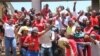 Workers strike outside the High Court in Blantyre, Malawi, Dec. 13, 2022. The nationwide strike is aimed at forcing the government to improve working conditions. 