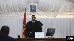 Judge Efigenio Baptista stands at the Maputo Central Prison on Dec. 7, 2022 while reading the sentence for Ndambi Guebuza, son of the former president of Mozambique Armando Guebuza, and others accused in the trial for a vast corruption scandal.