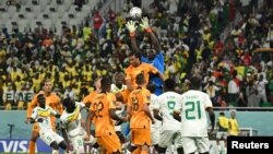 Senegal's Edouard Mendy in action with the Netherlands' Nathan Ake during the Senegal v Netherlands World Cup match at Al Thumama Stadium, Doha, Qatar, Nov. 21, 2022