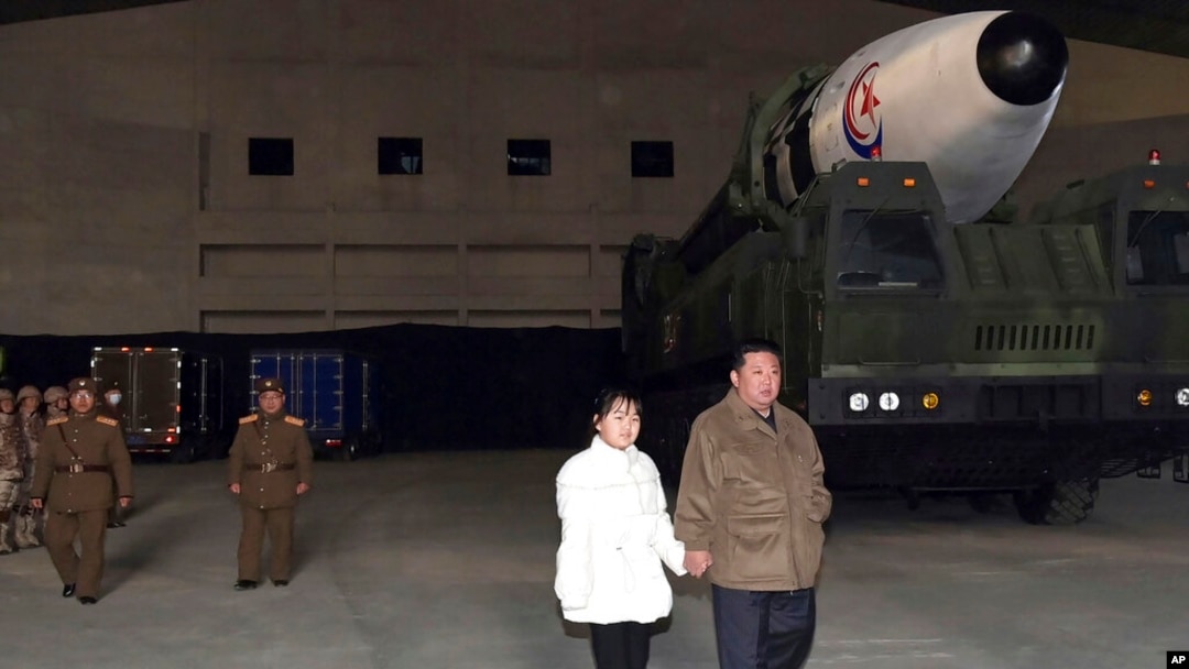 This photo provided on Nov. 19, 2022, by the North Korean government shows North Korean leader Kim Jong Un and his daughter inspecting a missile at Pyongyang International Airport in Pyongyang, North Korea, Nov. 18, 2022.