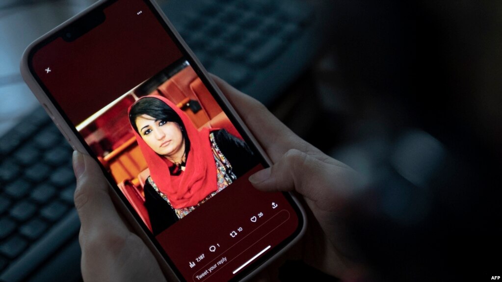 A photo of former Afghan lawmaker Mursal Nabizada who was shot dead by gunmen last night at her house in Kabul is seen on a mobile phone in Kabul, Afghanistan, Jan. 15, 2023.