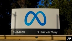 FILE - Meta's logo can be seen on a sign at the company's headquarters in Menlo Park, Calif., on Nov. 9, 2022.