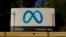FILE - Meta's logo can be seen on a sign at the company's headquarters in Menlo Park, Calif., on Nov. 9, 2022.