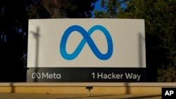 FILE - Meta's logo can be seen on a sign at the company's headquarters in Menlo Park, California, Nov. 9, 2022.