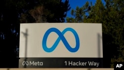 FILE - Meta's logo can be seen on a sign at the company's headquarters in Menlo Park, Calif., on Nov. 9, 2022.