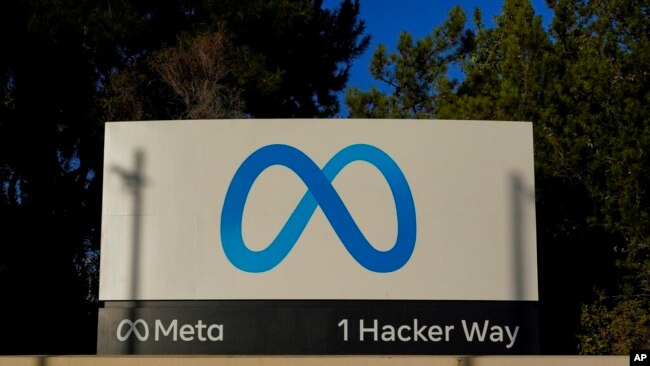 FILE - Meta's logo can be seen on a sign at the company's headquarters in Menlo Park, Calif., on Nov. 9, 2022.