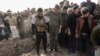 Syrian Kurds attend a funeral of people killed in Turkish airstrikes in the village of Al Malikiyah , northern Syria, Nov. 21, 2022. 