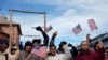 Manifestantes marchan para exigir el fin de la política migratoria denominada "Título 42", en El Paso, el 7 de enero de 2023. 