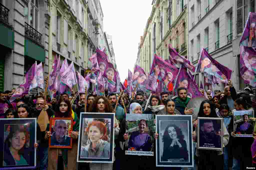 Members of the Kurdish community attend a march organized by the Kurdish Democratic Council in France (CDK-F) in tribute to the victims of Friday&#39;s deadly attack, in Paris, France.
