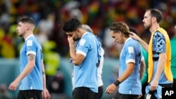 Uruguay's Luis Suarez, second from left, cries after the World Cup match between Ghana and Uruguay, at the Al Janoub Stadium in Al Wakrah, Qatar, Dec. 2, 2022. Uruguay won the match but was eliminated from the tournament after South Korea's victory over Portugal.