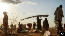 FILE - Somalis who have been displaced due to drought settle at a camp on the outskirts of Dollow, Somalia, Sept. 19, 2022. 