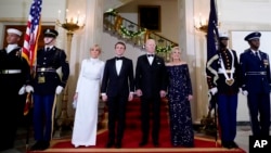 President Joe Biden and first lady Jill Biden pose for a photo with French President Emmanuel Macron and his wife Brigitte Macron in the White House before a State Dinner in Washington, Dec. 1, 2022. (AP Photo/Andrew Harnik)