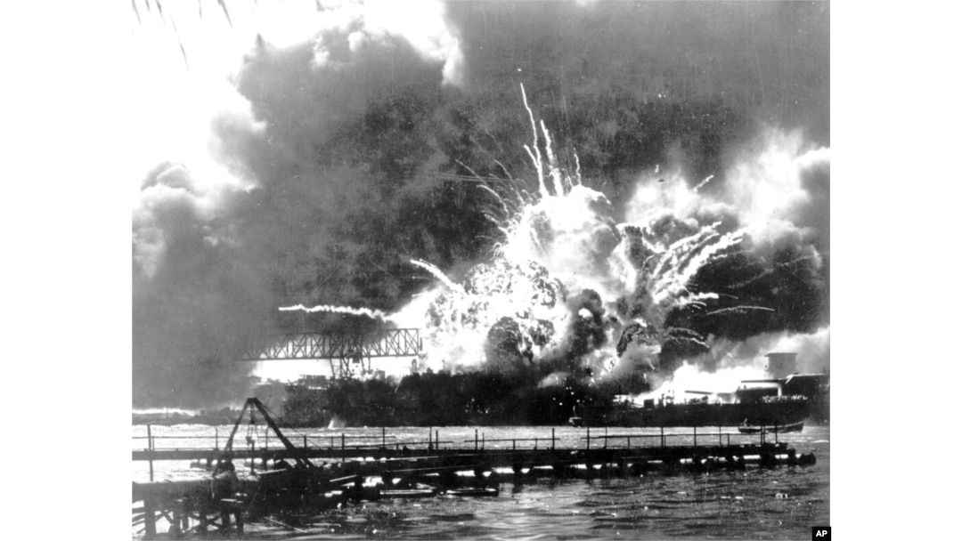 FILE - In this photo provided by the U.S. Navy, the destroyer USS Shaw explodes after being hit by bombs during the Japanese attack on Pearl Harbor, Hawaii, Dec. 7, 1941.
