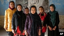 FILE - Afghan girls in Kabul, Afghanistan, Dec. 22, 2022. In addition to banning girls from attending middle and high school, the Taliban have indefinitely barred girls from taking private university entrance exams, tightening their ban on women’s education in the country.
