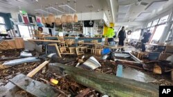 A support piece from the Capitola Wharf is seen inside the storm damaged Zelda's restaurant in Capitola, Calif., Jan. 5, 2023.