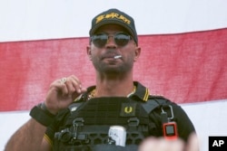 FILE - Proud Boys leader Henry "Enrique" Tarrio wears a hat that says The War Boys during a rally in Portland, Oregon, on Sept. 26, 2020.