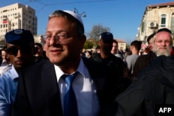 FILE - Itamar Ben Gvir, Israel's new Minister of National Security and leader of the far-right Otzma Yehudit (Jewish Power) party, arrives to visit Jerusalem's Mahane Yehuda market on Dec. 30, 2022.