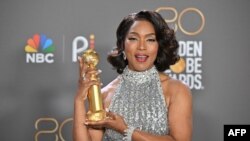 FILE: US actress Angela Bassett poses with the award for Best Supporting Actress - Motion Picture for "Black Panther: Wakanda Forever" in the press room during the 80th annual Golden Globe Awards at The Beverly Hilton hotel in Beverly Hills, California, on January 10, 2023