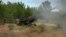 FILE - Ukrainian soldiers fire at Russian positions from a U.S.-supplied M777 howitzer in Ukraine's eastern Donetsk region, June 18, 2022. 
