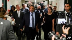 Manhattan District Attorney Alvin Bragg exits the courtroom after the jury found the Trump Organization guilty on all counts in a criminal tax fraud case, Dec. 6, 2022, in New York.