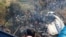 People gather after the plane crash in Pokhara, Nepal, Jan. 15, 2023 in this picture obtained from social media. (Naresh Giri/via Reuters)