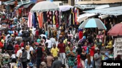 FILE - Shoppers crowd a market in Nigeria's commercial capital of Lagos. Taken August 15, 2019. 