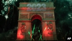A sound and light show is projected on the Arc de Triomphe during New Year celebrations in Paris, France, Jan. 1, 2023.