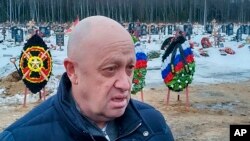 FILE - Wagner Group head Yevgeny Prigozhin is pictured at a cemetery outside St. Petersburg, Russia, Dec. 24, 2022. He said Feb. 16, 2023, that it could take months to capture the Ukraine city of Bakhmut and slammed Moscow's "bureaucracy" for slowing military gains.