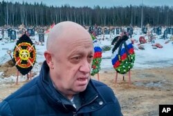 FILE - Wagner Group head Yevgeny Prigozhin is seen at the Beloostrovskoye cemetery outside St. Petersburg, Russia, Dec. 24, 2022.