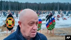 FILE - Wagner Group head Yevgeny Prigozhin at the Beloostrovskoye cemetery outside St. Petersburg, Russia, Dec. 24, 2022. In a video message, he said Wagner is "probably the most experienced army that exists in the world today." 