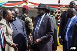 South Sudan's President Salva Kiir, center, attends the departure ceremony of the South Sudan People's Defence Forces, at SSPDF headquarters in Juba, Dec. 28, 2022.