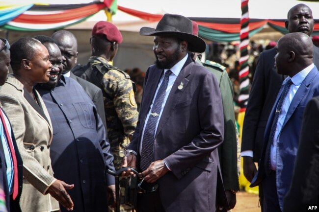 South Sudan's President Salva Kiir, center, attends the departure ceremony of the South Sudan People's Defence Forces, at SSPDF headquarters in Juba, Dec. 28, 2022.