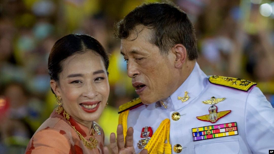 FILE - Thai King Maha Vajiralongkorn speaks with Princess Bajrakitiyabha while meeting supporters in Bangkok, Thailand, Nov. 1, 2020. 