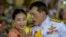 FILE - Thai King Maha Vajiralongkorn speaks with Princess Bajrakitiyabha while meeting supporters in Bangkok, Thailand, Nov. 1, 2020. 