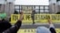 An activist shouts slogans during a protest against Indonesia's potential new criminal code outside the Indonesian Parliament buildings in Jakarta, Indonesia, Dec. 5, 2022. 