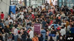 FILE - Passengers at Ninoy Aquino International Airport in Pasay, Metro Manila, Philippines, Jan. 1, 2023.