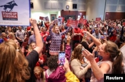 FILE - A Loudoun County School Board meeting was halted by the school board because the crowd refused to quiet down, in Ashburn, Virginia, U.S. June 22, 2021. (REUTERS/Evelyn Hockstein)