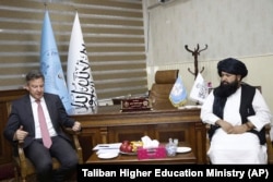 In this photo provided by the Taliban Higher Education Ministry, United Nations official Markus Potzel, left, meets with Taliban Higher Education Minister Nida Mohammad Nadim in Kabul, Afghanistan, Jan. 7, 2023.