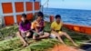Three Rohingya boys, after they were rescued on Dec. 25, 2022, by a Thai fishing boat, with the cooperation of the Thai Maritime forces. (Photo via Thailand Maritime Enforcement Command Center/Facebook)