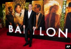 Brad Pitt, a cast member in "Babylon," poses at the premiere of the film, Thursday, Dec. 15, 2022, at the Academy Museum of Motion Pictures in Los Angeles. (AP Photo/Chris Pizzello)