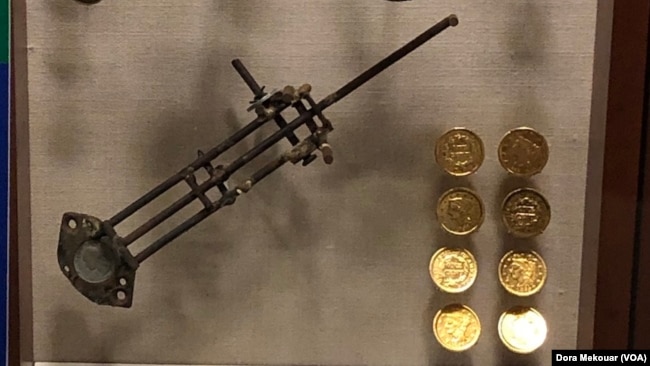 Counterfeit equipment and fake $10 gold coins made out of copper pennies on display at the U.S. Secret Service Museum. Secret Washington Museum