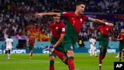 FILE - Portugal's Cristiano Ronaldo celebrates after scoring from the penalty spot his side's opening goal against Ghana during a World Cup Group H soccer match at the Stadium 974 in Doha, Qatar, Nov. 24, 2022.