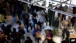 FILE - People shop during Black Friday in New York on Nov. 25, 2022.