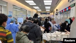 Patients lie on beds at the emergency department of Zhongshan Hospital, amid the COVID-19 outbreak in Shanghai, China, Jan. 3, 2023. 