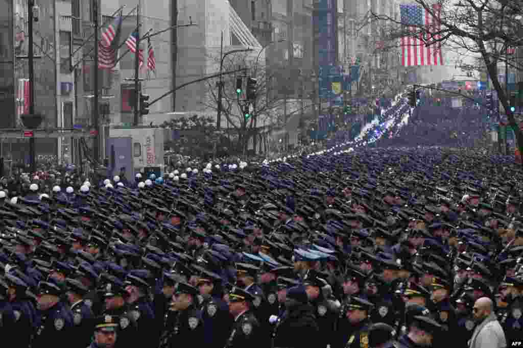 New York police officers gather for the funeral of NYPD officer Wilbert Mora, Feb. 2, 2022 in New York. Mora, 27, along with partner Jason Rivera, were killed on Jan. 21, as they responded to a domestic violence emergency.