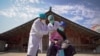 An elderly woman receives a COVID-19 vaccine in Danzhai, in China's southwestern Guizhou province.