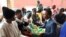 Umsekeli webandla le CCC, uMnu. Gift Ostallos Sizibaenikeza izipho asebekhulile bako Bulawayo.