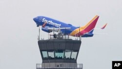 A Southwest Airlines passenger jet takes off from Chicago's Midway Airport as flight delays stemming from a computer outage at the Federal Aviation Administration brought departures to a standstill across the U.S earlier, Jan. 11, 2023, in Chicago.